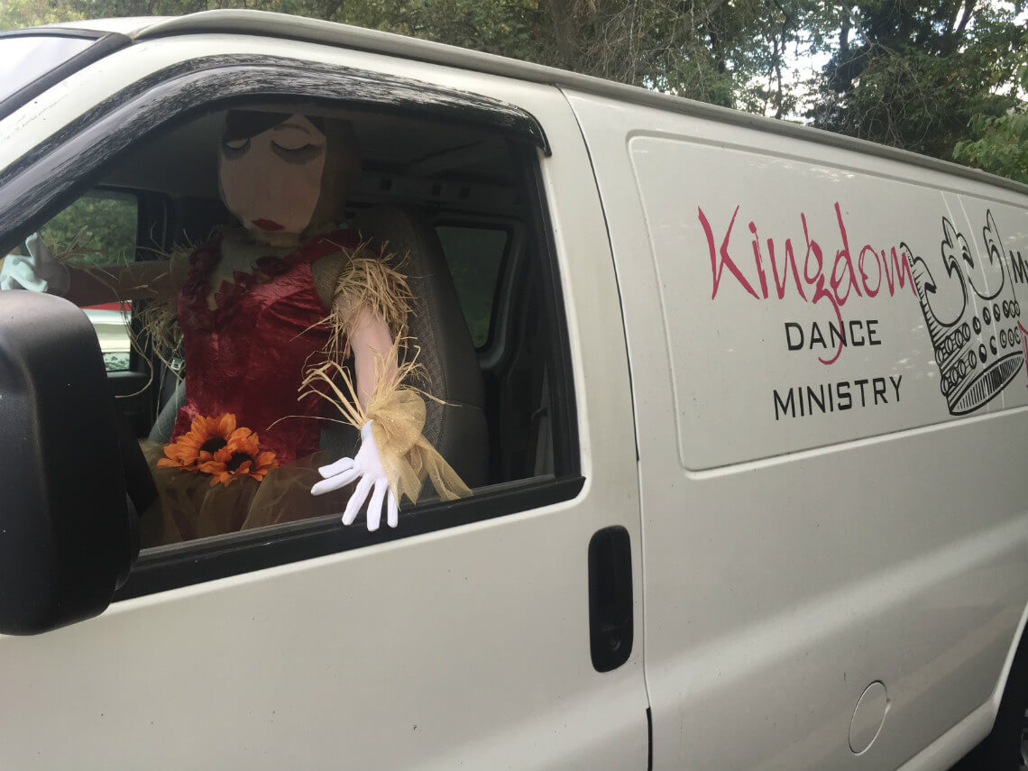 Scarecrow Driving a Van